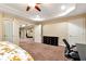 Spacious bedroom featuring carpet flooring, a ceiling fan, and ample natural light at 3332 Heathchase Ln, Suwanee, GA 30024