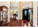 Grand foyer showcasing high ceilings, grand piano, and an elegant front door with sidelights at 3332 Heathchase Ln, Suwanee, GA 30024