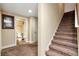 Hallway with stairs and access to a bathroom at 3332 Heathchase Ln, Suwanee, GA 30024
