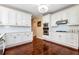 Updated kitchen with white cabinetry, stainless steel appliances, and bright subway tile backsplash at 3332 Heathchase Ln, Suwanee, GA 30024