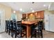 Kitchenette with a bar top and seating for several people, great for entertaining guests at 3332 Heathchase Ln, Suwanee, GA 30024