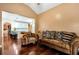 Comfortable living room offers hardwood floors and views into the spacious open kitchen at 3332 Heathchase Ln, Suwanee, GA 30024