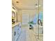 Modern bathroom featuring a soaking tub, glass shower, and double sink vanity at 415 Wood Trace Ct, Alpharetta, GA 30022