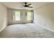 Spacious bedroom filled with natural light, featuring cozy carpet and stylish shutters at 415 Wood Trace Ct, Alpharetta, GA 30022