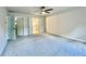 Spacious carpeted bedroom features an en-suite bathroom with modern fixtures at 415 Wood Trace Ct, Alpharetta, GA 30022