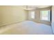 Spacious bedroom with ample natural light and neutral carpet at 415 Wood Trace Ct, Alpharetta, GA 30022