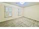 Bright bedroom with shuttered windows and neutral carpeting at 415 Wood Trace Ct, Alpharetta, GA 30022