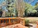 View from the house's wood deck looking out into the large shady backyard at 415 Wood Trace Ct, Alpharetta, GA 30022