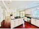 Open-concept kitchen with a center island, stainless steel appliances, and views of the living area at 415 Wood Trace Ct, Alpharetta, GA 30022
