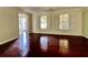 Elegant living room with hardwood floors, natural light, and neutral walls at 415 Wood Trace Ct, Alpharetta, GA 30022