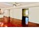 Hardwood floor open living room with access to the kitchen and a window at 415 Wood Trace Ct, Alpharetta, GA 30022