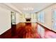 Bright living room features built-in shelving, a fireplace, hardwood floors, and a sliding glass door at 415 Wood Trace Ct, Alpharetta, GA 30022