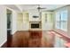 Bright living room featuring built-in shelving, a cozy fireplace, and abundant natural light at 415 Wood Trace Ct, Alpharetta, GA 30022