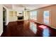Inviting living room with built-in shelving and cabinets, a fireplace, and access to the outdoor deck at 415 Wood Trace Ct, Alpharetta, GA 30022