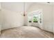 Bright dining room featuring neutral walls, carpet flooring, and a bay window for ample natural light at 85 Old Gettysburg Way, Dallas, GA 30157