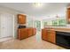 Charming kitchen with wood cabinets and breakfast bar area at 85 Old Gettysburg Way, Dallas, GA 30157