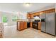 Well-lit kitchen with stainless steel refrigerator and dark range at 85 Old Gettysburg Way, Dallas, GA 30157
