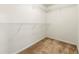 Bright walk-in closet features neutral carpet and white walls with wire shelving along the perimeter for functional storage space at 85 Old Gettysburg Way, Dallas, GA 30157