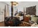 Luxurious bedroom featuring a four-poster bed, hardwood floors, and elegant decor at 1241 Hightower Nw Xing, Marietta, GA 30060