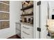 Butler's pantry featuring marble counters and custom cabinetry at 1241 Hightower Nw Xing, Marietta, GA 30060