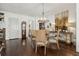 Dining area with a chandelier, hardwood floors, and seamless entryways for modern living at 1241 Hightower Nw Xing, Marietta, GA 30060