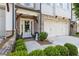Inviting front porch with seating, a wreath on the front door, and charming curb appeal at 1241 Hightower Nw Xing, Marietta, GA 30060