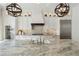 Bright kitchen featuring white cabinets, stainless steel appliances, and a large island with a marble countertop at 1241 Hightower Nw Xing, Marietta, GA 30060