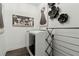 A modern laundry room with front-load washer and dryer and unique decorative wall art at 1241 Hightower Nw Xing, Marietta, GA 30060