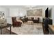An elegant living room with stylish furniture, decorative wall art, and a modern chandelier at 1241 Hightower Nw Xing, Marietta, GA 30060