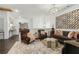 An elegant living room featuring stylish furniture, an ornate chandelier, and modern decor at 1241 Hightower Nw Xing, Marietta, GA 30060