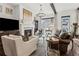 Cozy living room with a fireplace, ample seating, and stylish decor for comfortable living at 1241 Hightower Nw Xing, Marietta, GA 30060