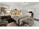 Elegant main bedroom with chandelier, sitting area, and adjoining rooms at 1241 Hightower Nw Xing, Marietta, GA 30060