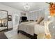 Comfortable main bedroom with neutral tones, chandelier and view to en-suite bathroom at 1241 Hightower Nw Xing, Marietta, GA 30060