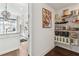 Organized walk-in pantry with shelves and drawers next to the modern kitchen at 1241 Hightower Nw Xing, Marietta, GA 30060
