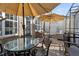 Inviting outdoor patio features brick flooring, patio seating under umbrellas, and stylish outdoor decor at 1241 Hightower Nw Xing, Marietta, GA 30060