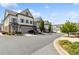 Street view of townhomes featuring manicured landscaping and a welcoming neighborhood setting at 1241 Hightower Nw Xing, Marietta, GA 30060
