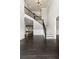 Spacious foyer with high ceilings, chandelier, staircase, and beautiful dark hardwood floors at 3415 Kenyon Creek Nw Dr, Kennesaw, GA 30152