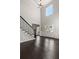 Elegant foyer with high ceilings, chandelier, staircase, and glass double doors at 3415 Kenyon Creek Nw Dr, Kennesaw, GA 30152