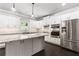 Modern kitchen with stainless steel appliances, white cabinets, and granite countertops at 3415 Kenyon Creek Nw Dr, Kennesaw, GA 30152