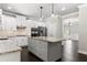 Kitchen island with granite countertop and ample storage in a bright, modern kitchen at 3415 Kenyon Creek Nw Dr, Kennesaw, GA 30152