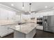 Modern kitchen with stainless steel appliances, white cabinets, and granite countertops at 3415 Kenyon Creek Nw Dr, Kennesaw, GA 30152
