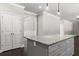 Granite countertop on kitchen island featuring drawers and cabinets for storage at 3415 Kenyon Creek Nw Dr, Kennesaw, GA 30152