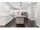 Spacious kitchen with large island, stainless steel appliances and dark hardwood floors at 3415 Kenyon Creek Nw Dr, Kennesaw, GA 30152