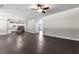 Spacious living room features hardwood floors and is adjacent to the gourmet kitchen at 3415 Kenyon Creek Nw Dr, Kennesaw, GA 30152