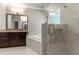 Luxurious bathroom with separate shower, garden tub, dual sink vanity and marble throughout at 3415 Kenyon Creek Nw Dr, Kennesaw, GA 30152