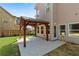 Covered patio with concrete flooring and a view of backyard, offering shade and an extension of the home at 3415 Kenyon Creek Nw Dr, Kennesaw, GA 30152