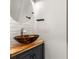 Contemporary powder room featuring a vessel sink, modern faucet, and unique brick wall at 3415 Kenyon Creek Nw Dr, Kennesaw, GA 30152