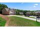 Beautiful homes line the street, showcasing well-manicured lawns and mature trees, creating a picturesque neighborhood setting at 3415 Kenyon Creek Nw Dr, Kennesaw, GA 30152