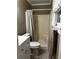 This bathroom features a toilet, shower, and a modern white sink cabinet at 3474 Leaf Land Ct, Duluth, GA 30097