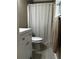 This bathroom features a toilet, shower, and a modern white sink cabinet at 3474 Leaf Land Ct, Duluth, GA 30097